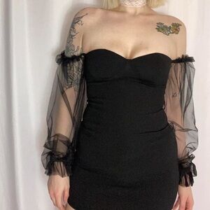 Two Bodycon dresses with sleeves.